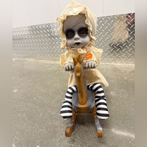 Creepy Doll on Rocking Horse with Striped Legs